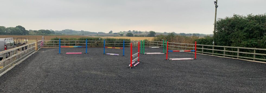 Freshly cleaned rubber chippings in a horse arena