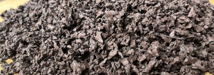 A pile of brown rubber chippings